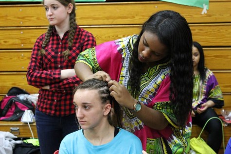 In the DiBart gym, the African American clubs offer to braid students' hair.