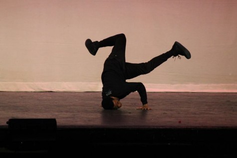 African American club dances to hip-hop and shows off amazing skills on stage.